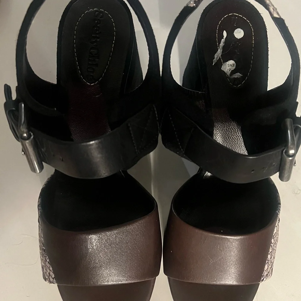 See by Chloe . Black , brown and python print platform heels.